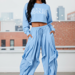 Light Blue Wavy Oversized Pants styled with NC sweatshirt and sneakers