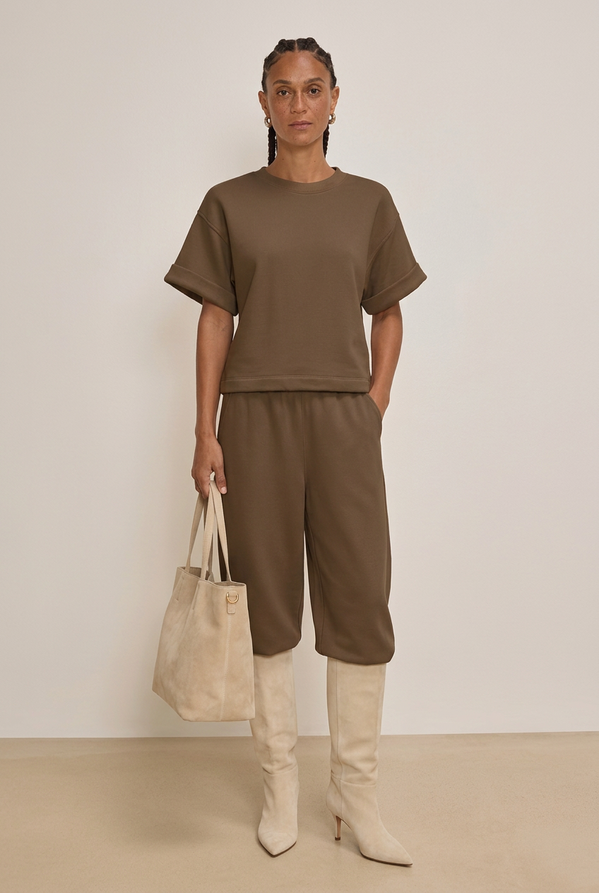 Studio-styled outfit with cream suede boots and matching tote