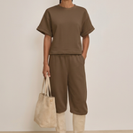 Studio-styled outfit with cream suede boots and matching tote