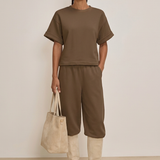 Studio-styled outfit with cream suede boots and matching tote
